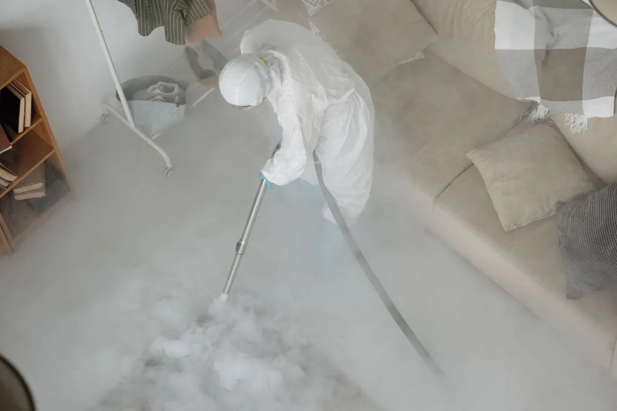 Biohazard cleanup technician in protective equipment, Aptos, CA